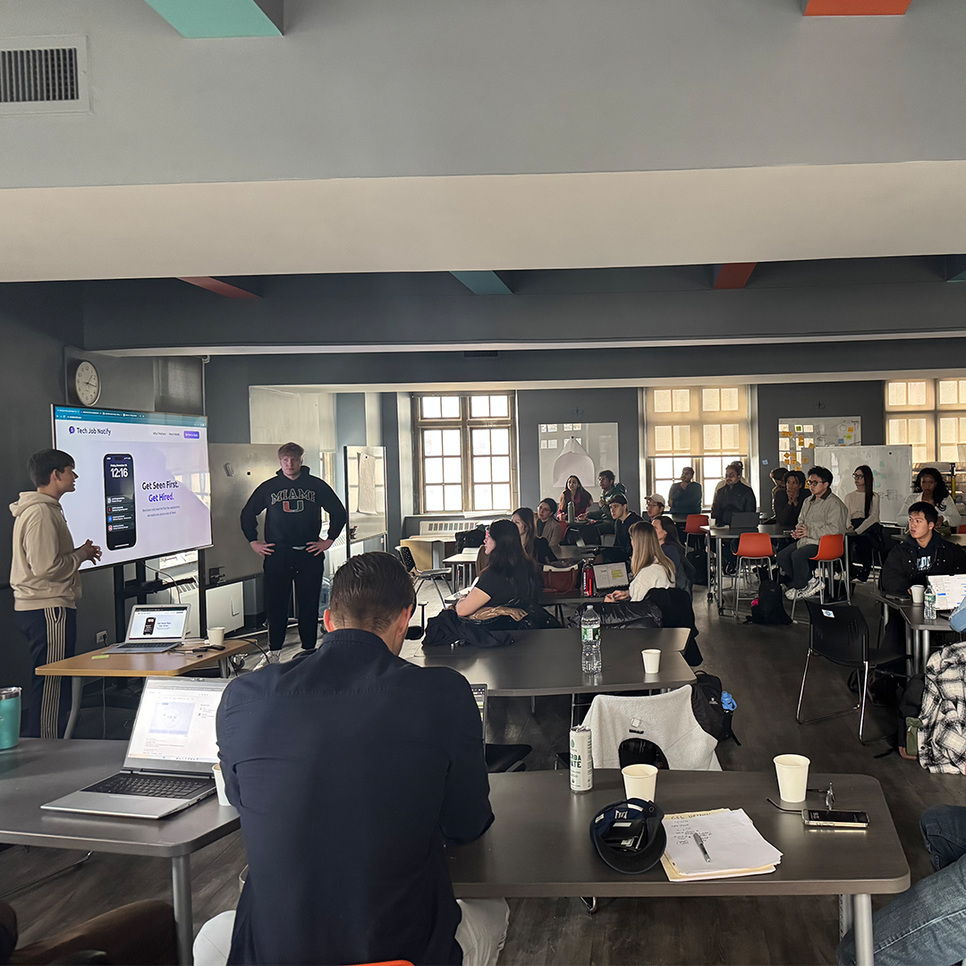 Picture of people presenting in front of a crown at Columbia Startup Lab Uptown